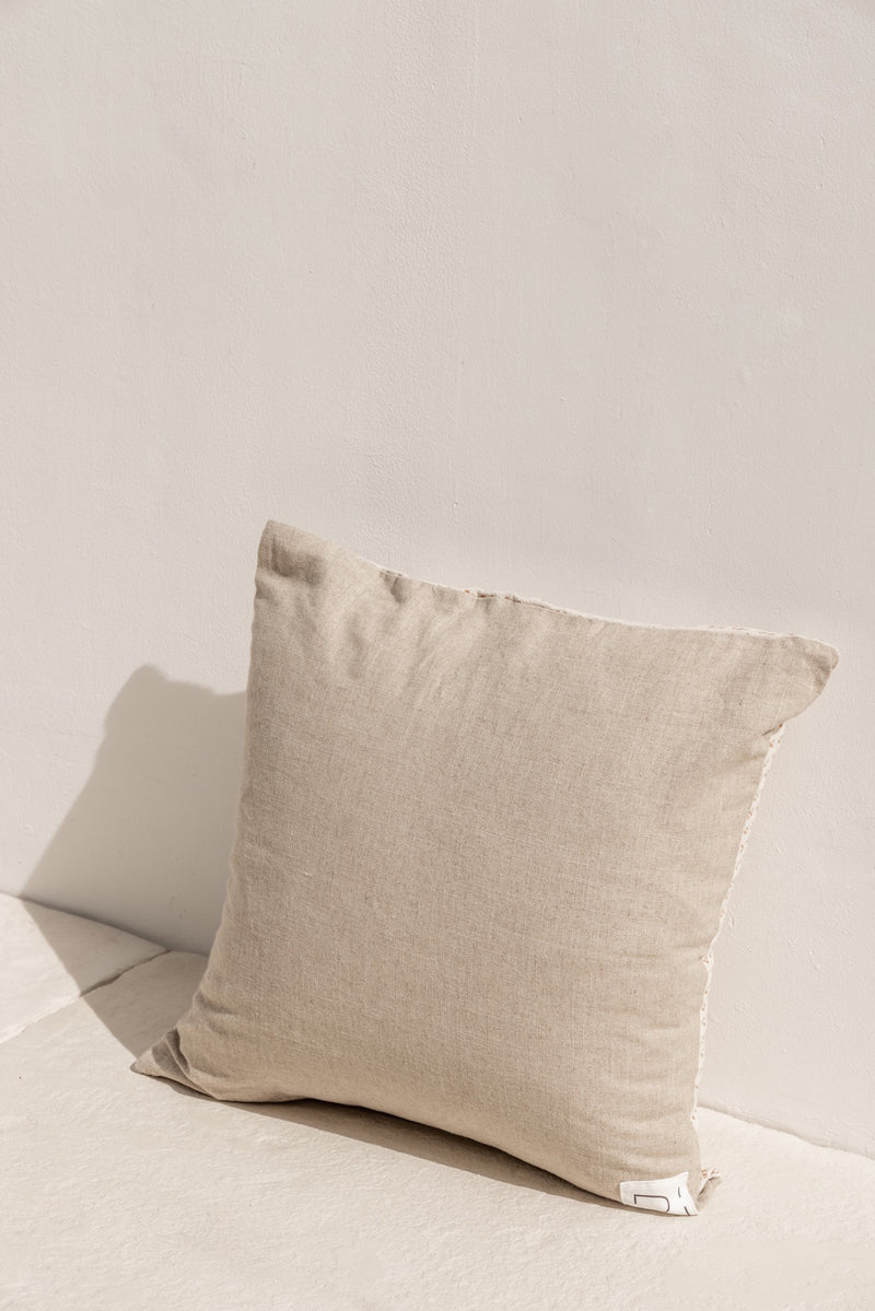 back side of the cushion cover jati, beige linen fabric.