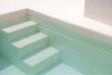 photograph by sheila man of white minimalistic pool stairs