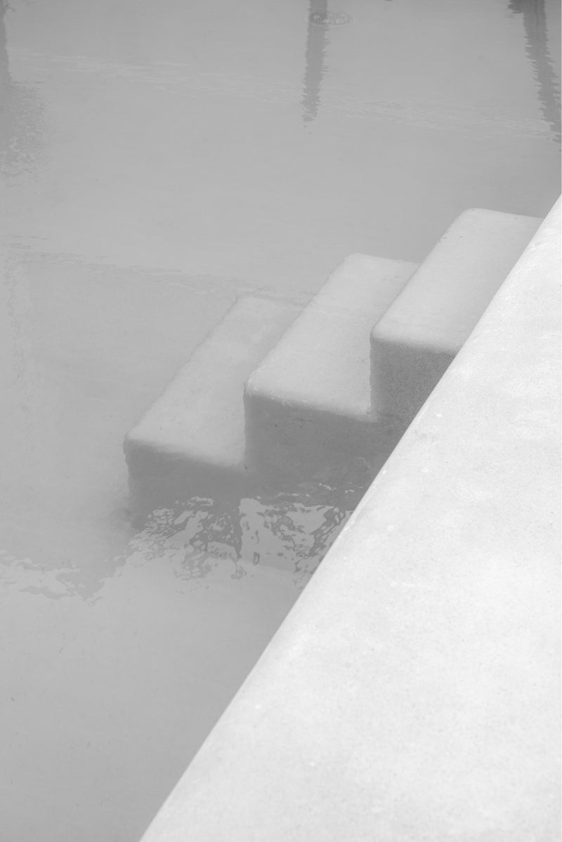 black and white photograph by sheila man of pool stairs in bali 