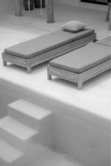 black and white photograph by sheila man of sun loungers and minimalistic pool