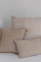 fringe cushion cover arrange with other natural cushion covers