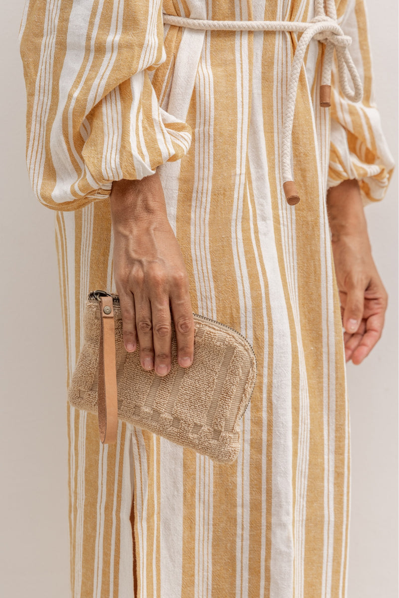 model with the pouch made out of beige towel fabric