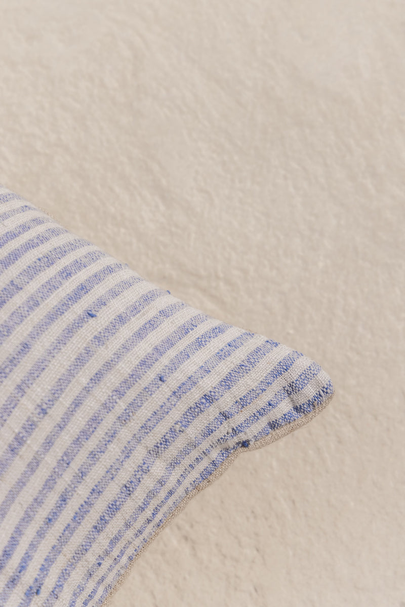 detail of hand made cushion cover with blue stripes