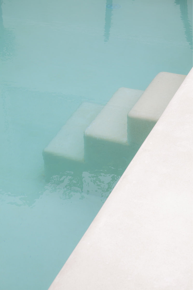 photograph by sheila man of white minimalistic pool stairs in a private bali villa