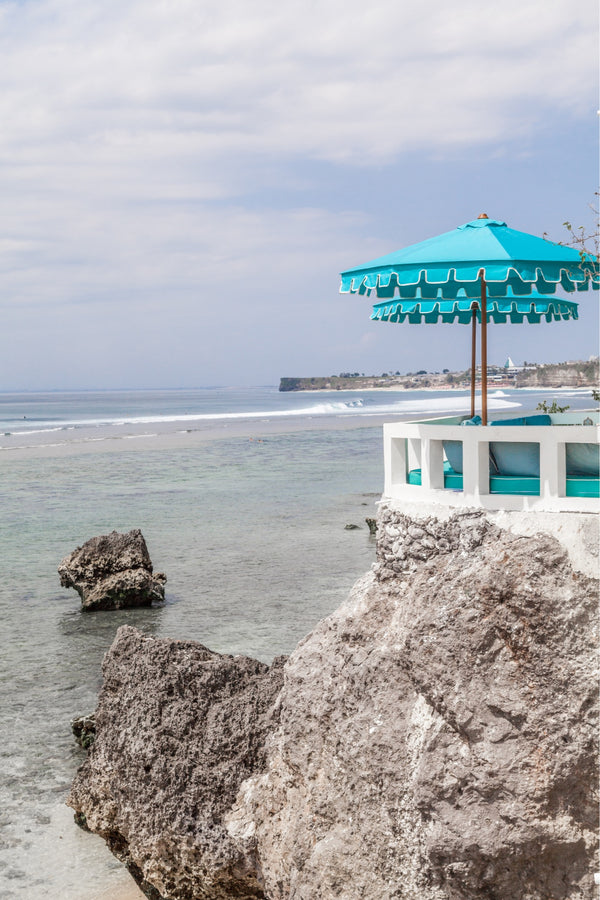 bali poster photograph with umbrellas, cliffs and the ocean