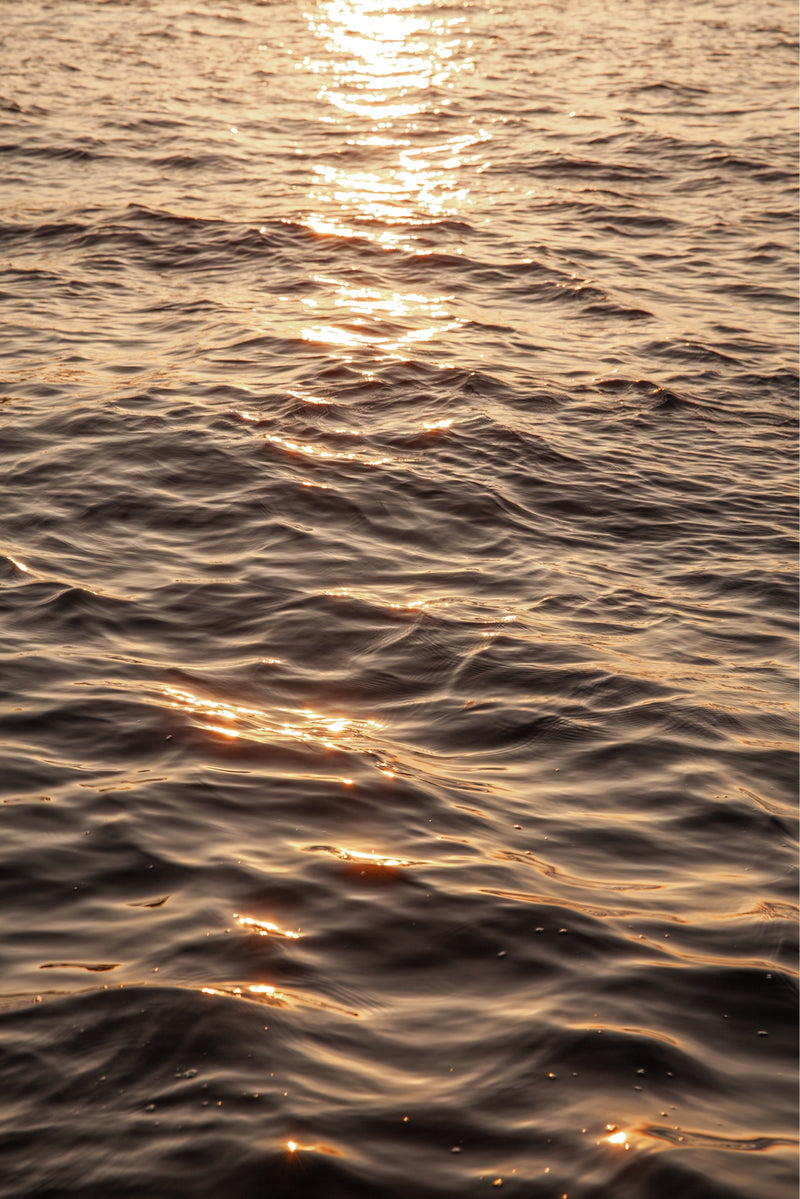 photograph of the flores ocean with the sunset reflecting