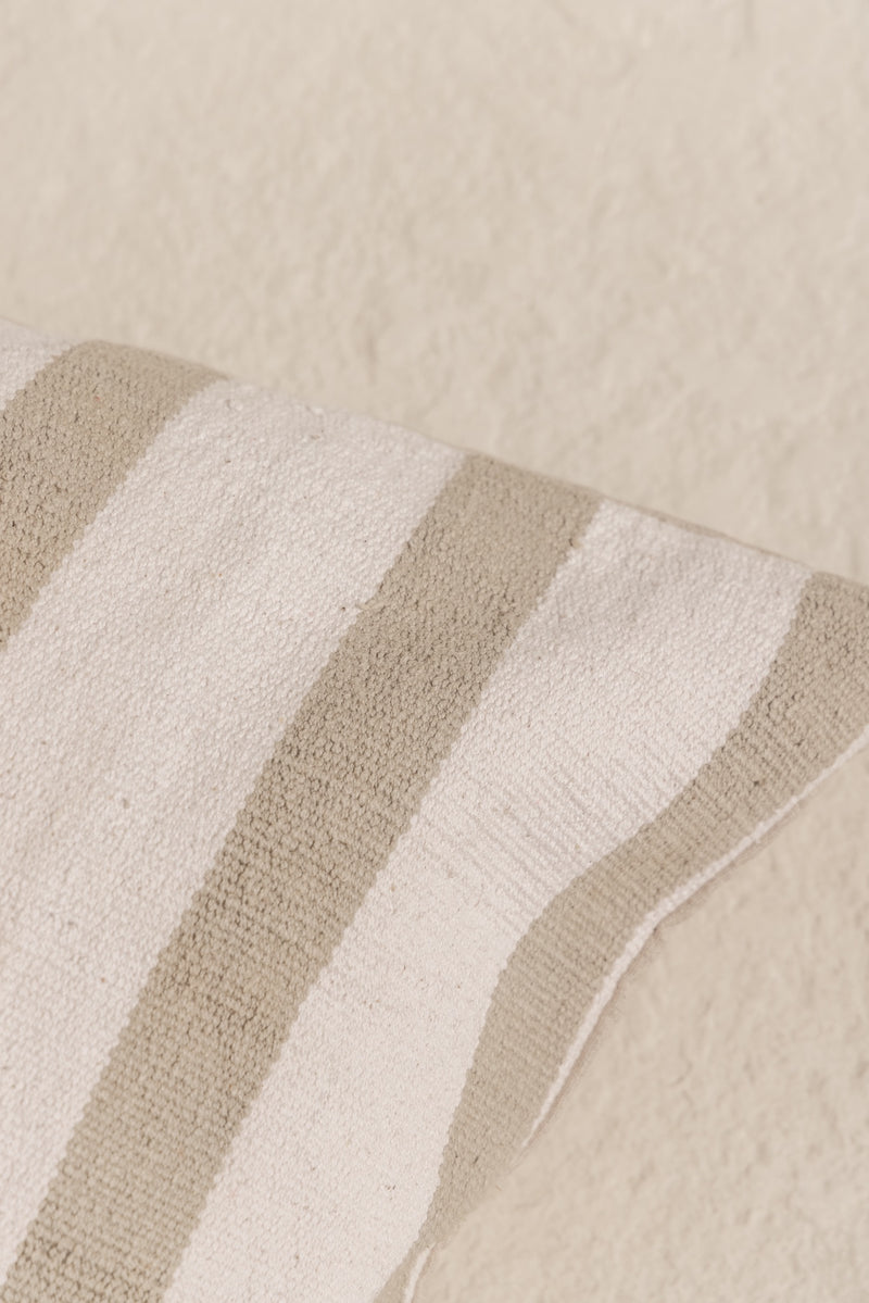 detail of daun cushion cover with olive green stripes