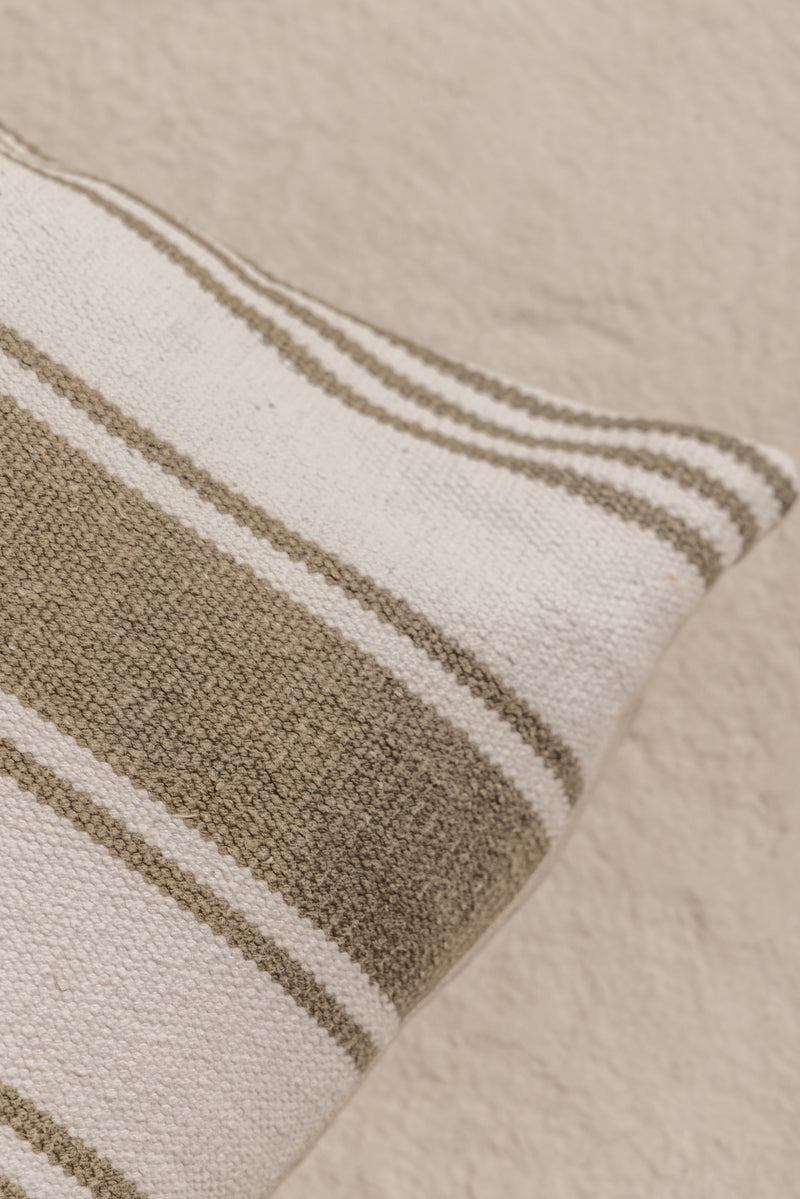 detail of army green stripped cushion cover