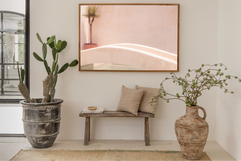 slightly pink coloured wall decoration with bali posters by sheila man